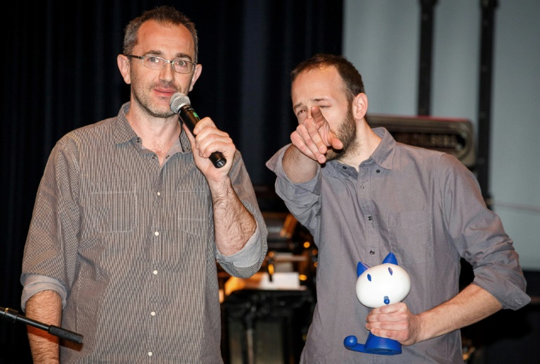 Wilfrid Lupano (g) et Paul Cauuet lors du 42e Festival international de la bande dessinée d'Angoulême le 1er février 2015